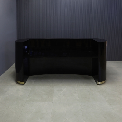 The Pill Custom Reception Desk in black gloss laminate main desk and brushed gold toe-kick, shown here.