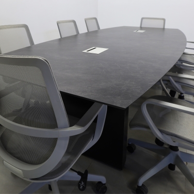 120-inch Aurora Boat Conference Table in 1/2-inch Black amani engineered surface top, black traceless laminate standard base, and 2 silver MX3 power boxes.