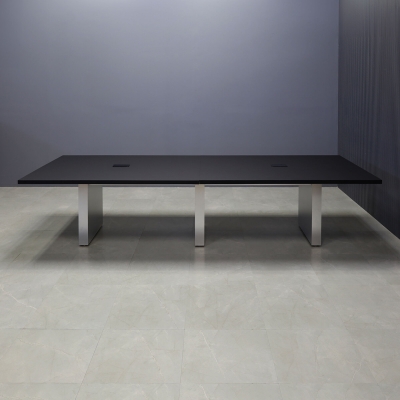 144-inch Newton Rectangular Conference Table in black traceless laminate top and brushed aluminum laminate standard base, with two black power boxes, shown here.