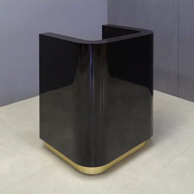 32-inch Nola Podium & Host Custom Desk in black gloss laminate main desk, and brushed gold toe-kick.