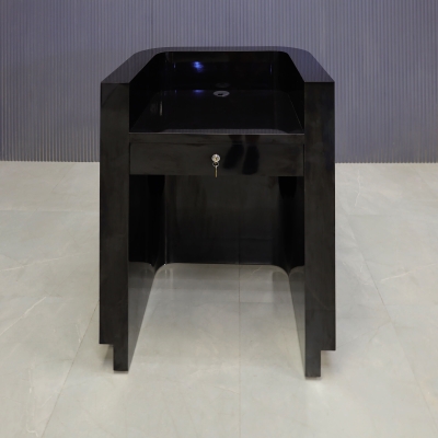 32-inch Nola Podium & Host Custom Desk in black gloss laminate main desk, and brushed gold toe-kick. Built-in pencil drawer with lock.