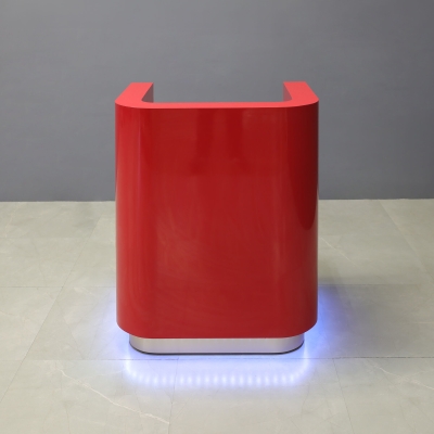 32-inch Nola Podium & Host in classic red gloss laminate main desk, brushed aluminum toe-kick, and warm white LED.