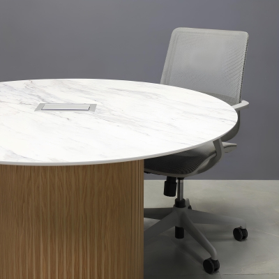 48-inch Aurora Round Conference Table in 1/2-inch calcutta blanc engineered surface top, white oak tambour base, and silver MX3 power box.