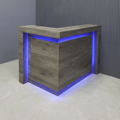 48-inch New York L-Shape Custom Reception Desk, left side l-panel when facing front, in metropolitan concrete PVC laminate desk, with color LED, shown here.