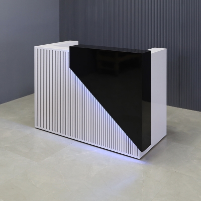 60-inch Miami Custom Reception Desk in black gloss laminate counter and white gloss laminate desk workspace and grooved front panel, with multi-colored LED, shown here.