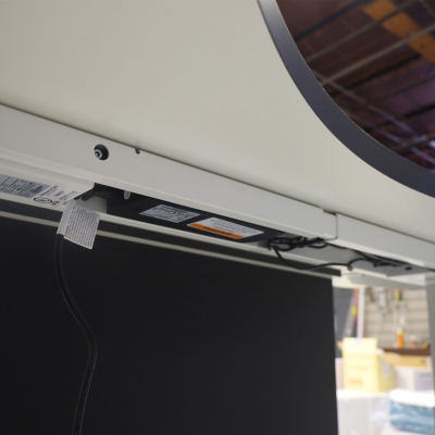 60-inch aXis Sit-stand Executive Desk with black traceless laminate top & privacy panel, and white metal legs, shown here.