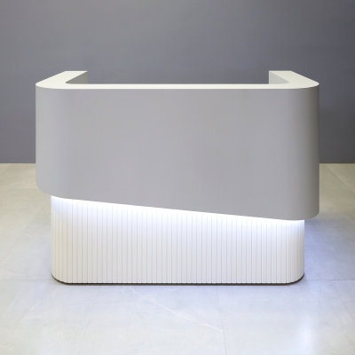 60-inch Nola Curved Reception Desk in folkstone gray matte laminate counter & inside desk, white tambour outside desk, and warm white LED.