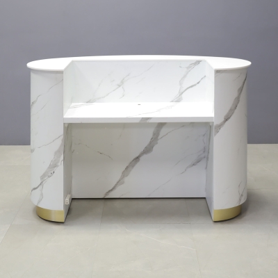 62-inch The Pill Custom Reception Desk in 1/2-inch white solid engineered surface top counter, calcutta stone PVC main desk, gold aluminum toe-kick, and warm white LED.