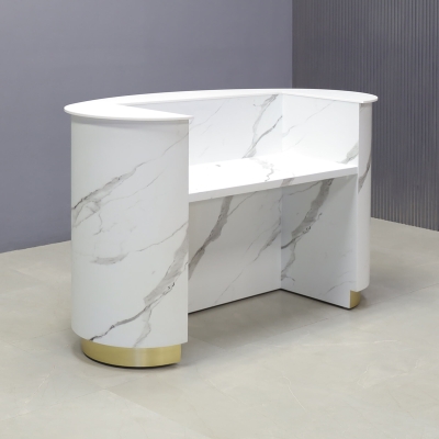 62-inch The Pill Custom Reception Desk in 1/2-inch white solid engineered surface top counter, calcutta stone PVC main desk, gold aluminum toe-kick, and warm white LED.