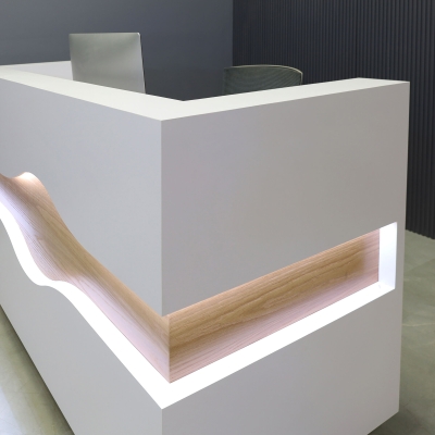 72-inch Wave Reception Desk in white matte laminate main desk, white oak waved accent, brushed aluminum toe-kick, and warm white LED.