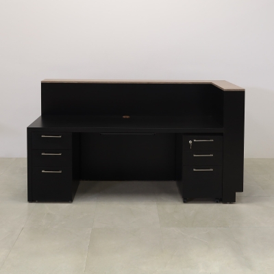 84-inch Manhattan L-Shape Custom Reception Desk in walnut heights matte laminate accent panel and top counter, and black traceless laminate main desk. Gold aluminum toe-kick, with multi-colored LED, shown here.