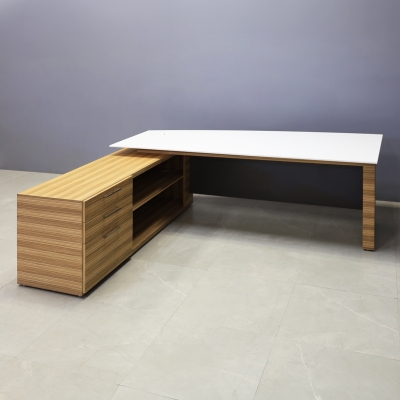 84-inch Avenue Curved Executive Desk with Credenza in 1/2-inch white solid engineered surface top, zebrawood veneer credenza & leg, and storm gray matte laminate privacy panel.