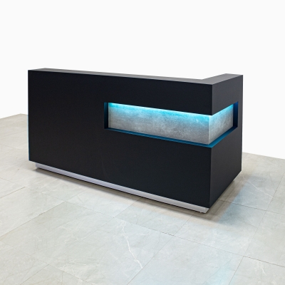 90-inch Manhattan L-Shape Custom reception Desk in metropolitan concrete pvc accent panel, black traceless laminate main desk, and brushed aluminum toe-kick, with multi-colored LED, shown here.