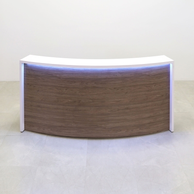 90-inch Seattle X1 Custom Reception Desk in white matte laminate desk, and hazel walnut matte laminate curved front panel, with multi-colored LED, shown here.