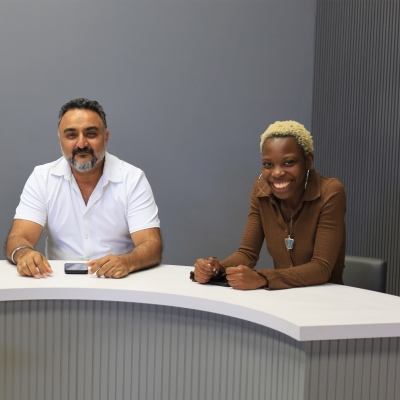 90-inch Modern Custom Podcast Table in white matte laminate top, fog gray tambour front side, and white matte laminate inside.