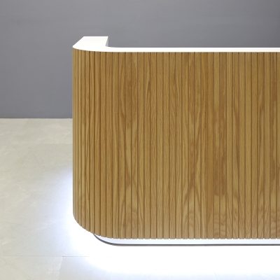 90-inch Nola Custom Reception Desk in white oak tambour main desk, white matte laminate workspace & toe-kick, and warm white LED.