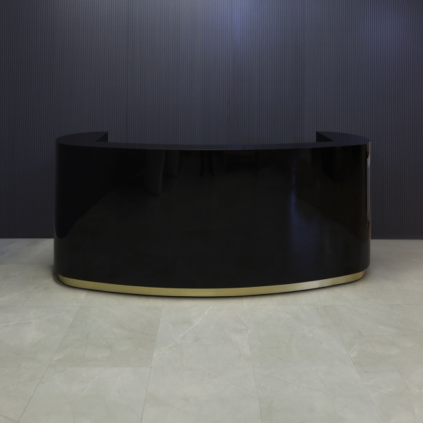 The Pill Custom Reception Desk in black gloss laminate main desk and brushed gold toe-kick, shown here.
