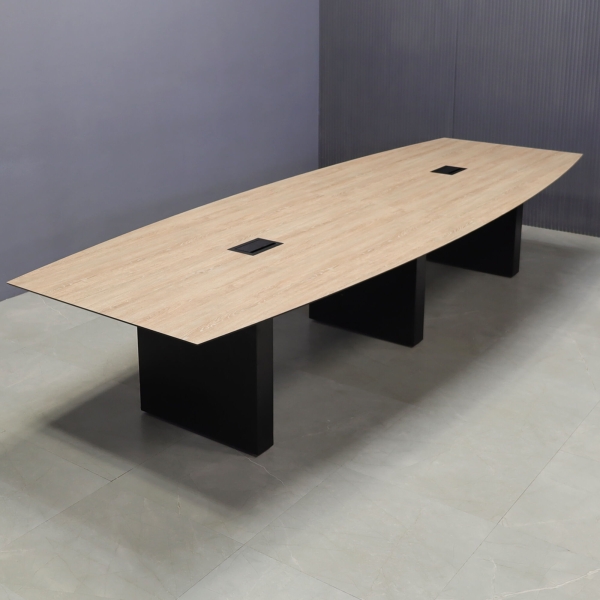 144-inch Aurora Boat Conference Table in 1/2-inch countryside oak engineered surface top, black matte laminate base, and two black MX3 power boxes.