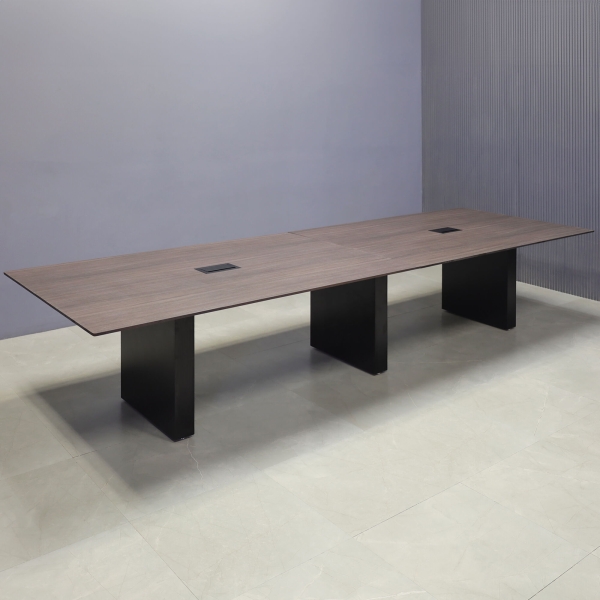 144-inch Aurora Rectangular Conference Table in 1/2-inch Gray oak engineered surface top, black matte laminate standard base, and 2 black MX3 power boxes.
