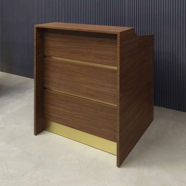 32-inch New Jersey Podium & Host Custom Reception Desk in walnut heights matte laminate main desk & front panels, and brushed gold accent & toe-kick.