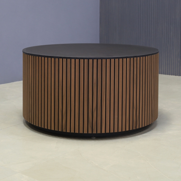 36-inch Norfolk Round Lobby Table in 1/2-inch black traceless engineered surface top, walnut tambour table, and black traceless laminate toe-kick.