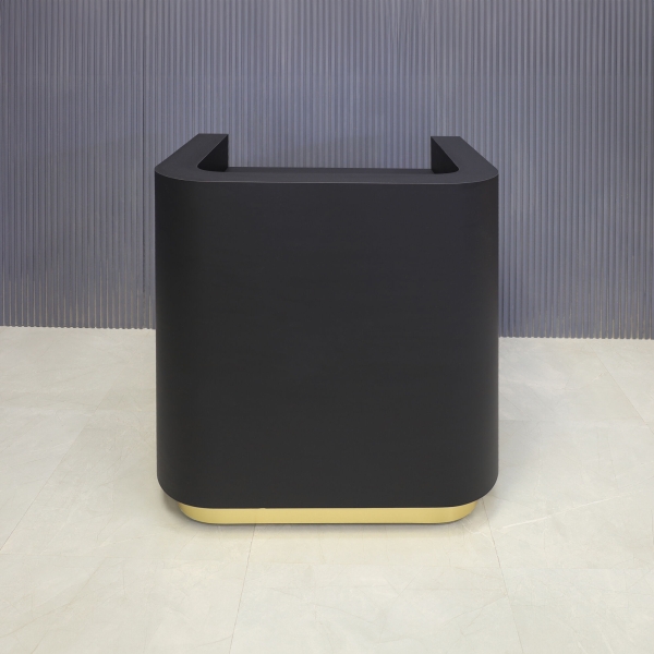 36-inch Nola Podium & Host in black traceless laminate main desk and brushed gold toe-kick.