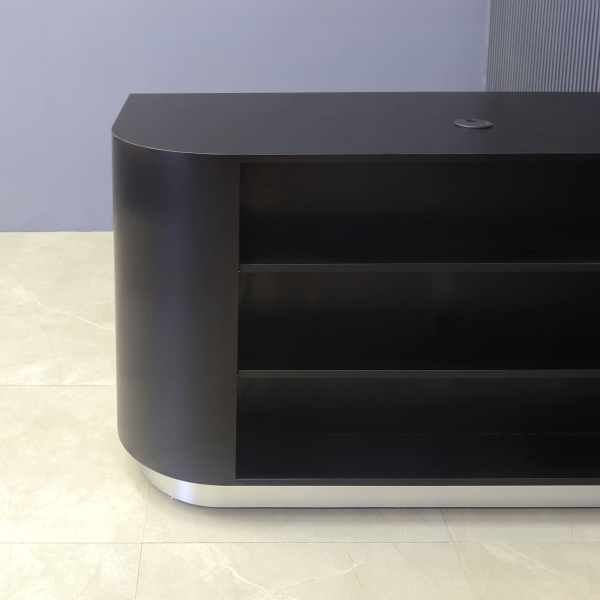 48-inch Nola Retail Custom Reception Desk in black matte laminate main desk with 2 adjustable shelves, and brushed aluminum toe-kick.