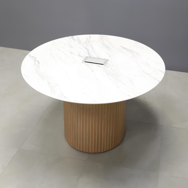 48-inch Aurora Round Conference Table in 1/2-inch calcutta blanc engineered surface top, white oak tambour base, and silver MX3 power box.