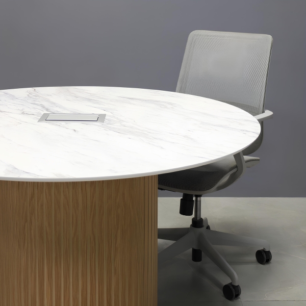 48-inch Aurora Round Conference Table in 1/2-inch calcutta blanc engineered surface top, white oak tambour base, and silver MX3 power box.