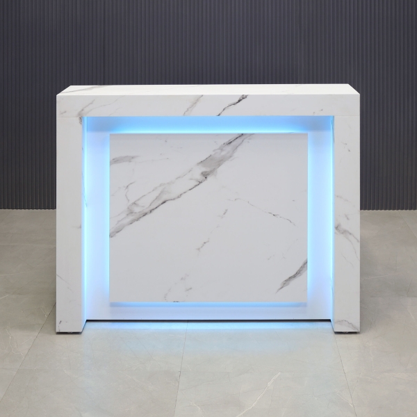 48-inch New York Straight Shape Custom Reception Desk in calcutta blanc stone pvc main desk and front panel, and white gloss laminate accent recessed, with multi-colored LED, shown here.