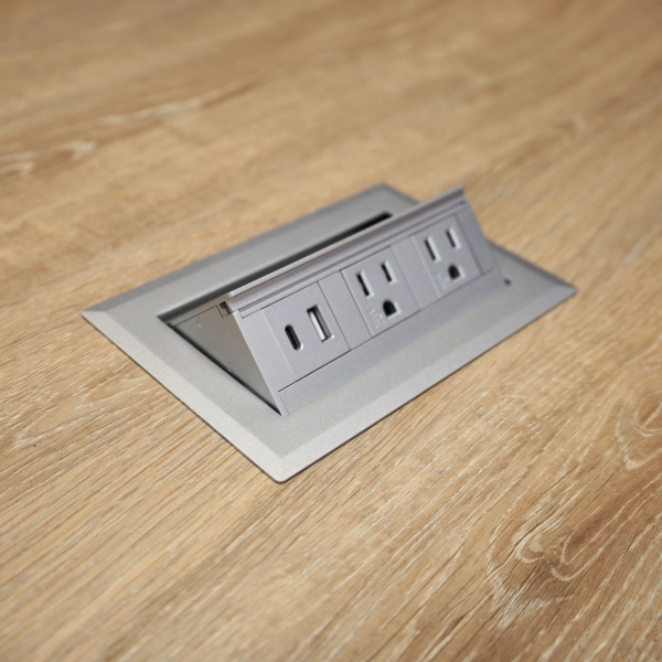 54-inch Aurora Round Conference Table in 1/2-inch Countryside oak engineered surface top, brushed aluminum base, and one silver MX2 power box.