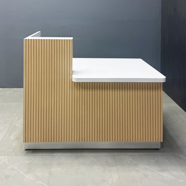 55-inch Dallas ADA Reception Desk in maple tambour desk counter on the left side when facing front, white matte laminate workspace, and brushed aluminum toe-kick.