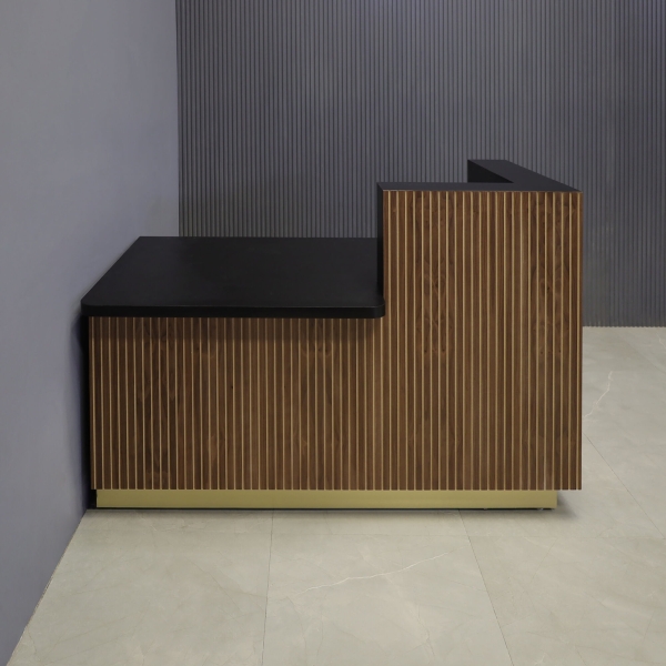 60-inch Dallas ADA Compliant Counter Custom Reception Desk, l-shape counter & desk on the right side when facing front in walnut tambour, black matte laminate workspace, and gold aluminum toe-kick.