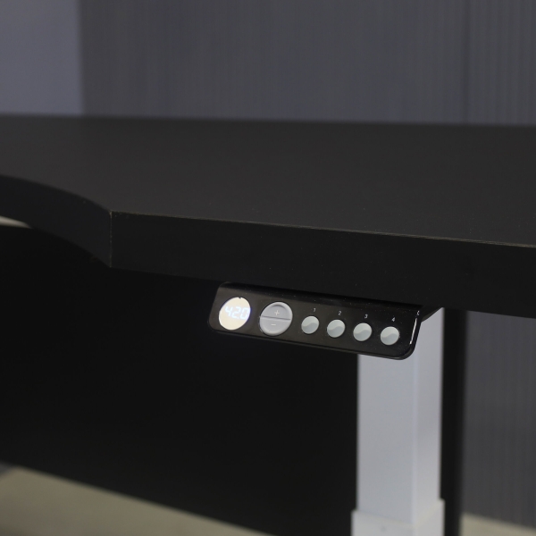 60-inch aXis Sit-stand Executive Desk with black traceless laminate top & privacy panel, and white metal legs, shown here.