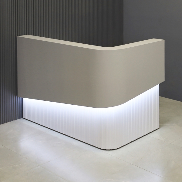 60-inch Nola L-Shape Curved Custom Reception Desk in folkstone gray matte laminate counter, white matte tambour fornt desk and white matte laminate workspace, with white LED, shown here.