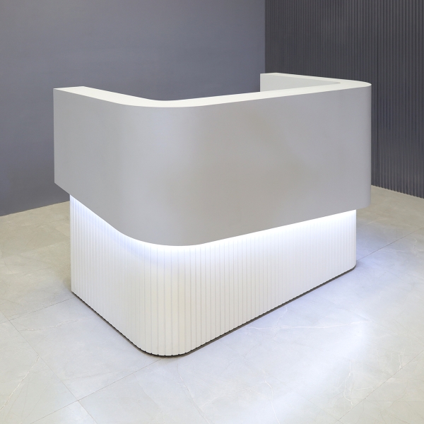 60-inch Nola Curved Custom Reception Desk in folkstone gray matte laminate counter & inside desk, white matte tambour front desk, and warm white LED.