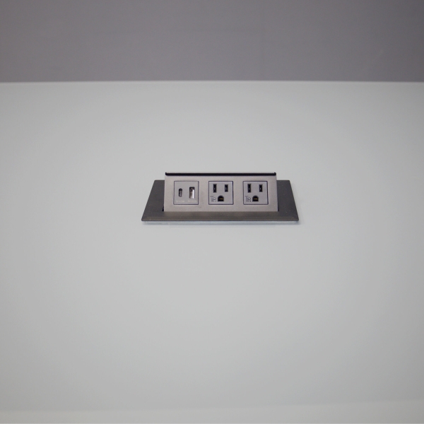 60-inch Omaha Rectangular Conference Table In 1/2-inch medium gray tempered glass top, black matte laminate base, and one black MX2 power box.