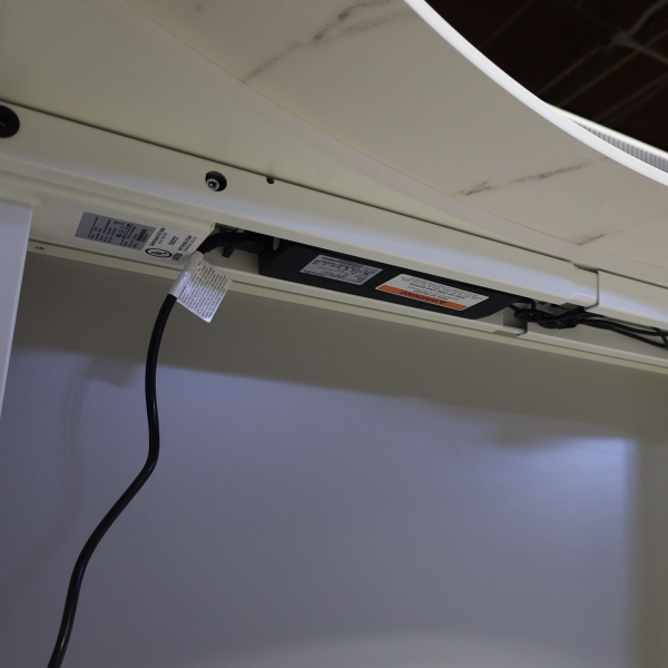 60-inch aXis Sit-stand Executive Desk in 1/2-inch solenne marble engineered surface top, folkstone matte laminate privacy panel and white metal base finish.