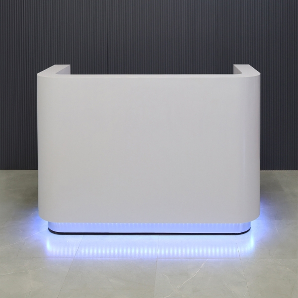60-inch Nola Reception Desk in white gloss laminate main desk, brushed aluminum toe-kick, and color changing LED.