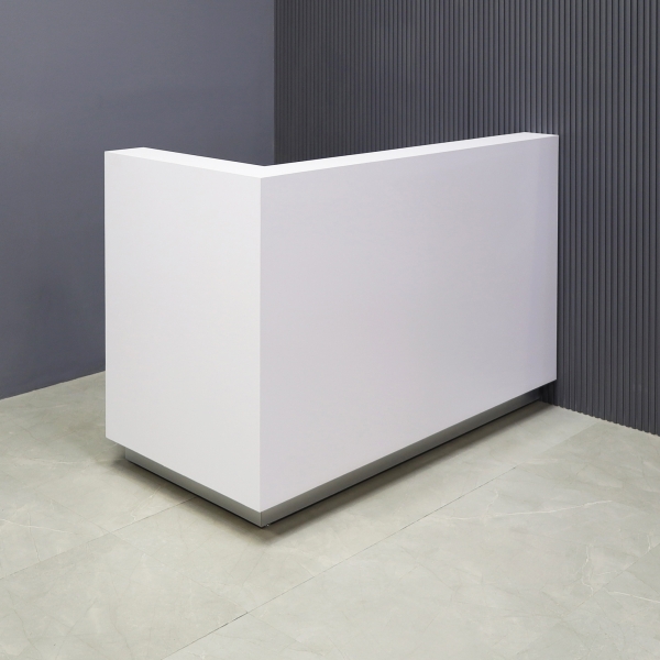 60-inch Dallas L-Shape Custom Reception Desk, left side l-panel when facing front in white matte laminate main desk and brushed aluminum toe-kick, shown here.