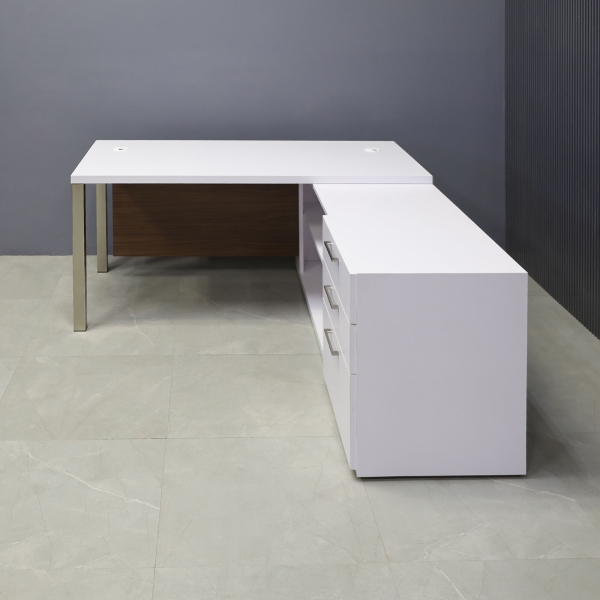 60-inch Dallas Executive Desk with credenza on the right side when sitting, in white matte laminate top & credenza, walnut heights matte laminate privacy panel, and brushed aluminum legs, shown here.