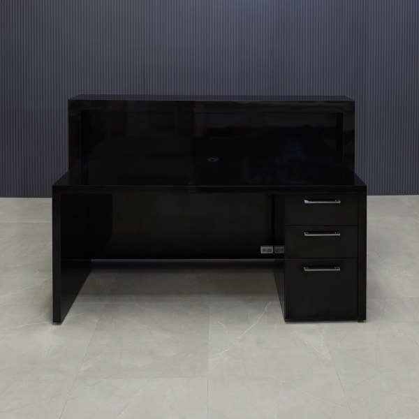 72-inch Vegas Custom Reception Desk in black gloss laminate counter and desk, with multi-colored LED, built-in two pencil drawers, and one file cabinet on the right side while sitting, shown here.
