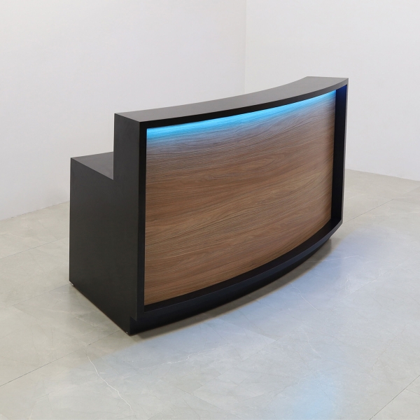 72-inch Seattle X2 Reception Desk in Black Matte Laminate Desk and Uptown Walnut Front Panel, with colored LED, shown here.