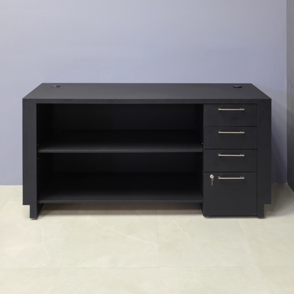 72-inch Houston Retail Custom Reception Desk in black traceless laminate main desk and brushed aluminum toe-kick. Built-in storage on the right side when sitting, one adjustable shelf, and one fixed shelf.