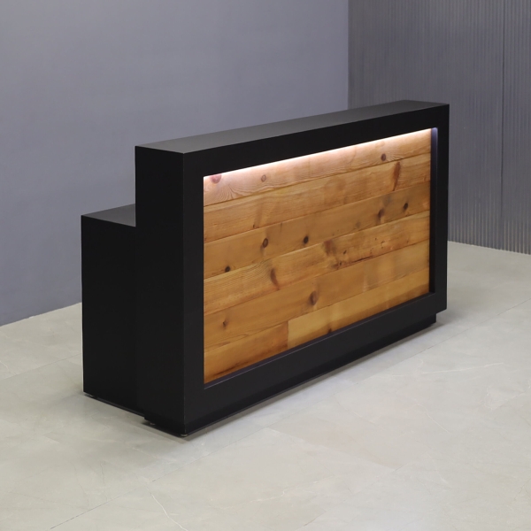 72-inch Vegas Designer Reception Desk in black traceless laminate main desk and reclaimed wood front panel, with warm white LED, shown here.