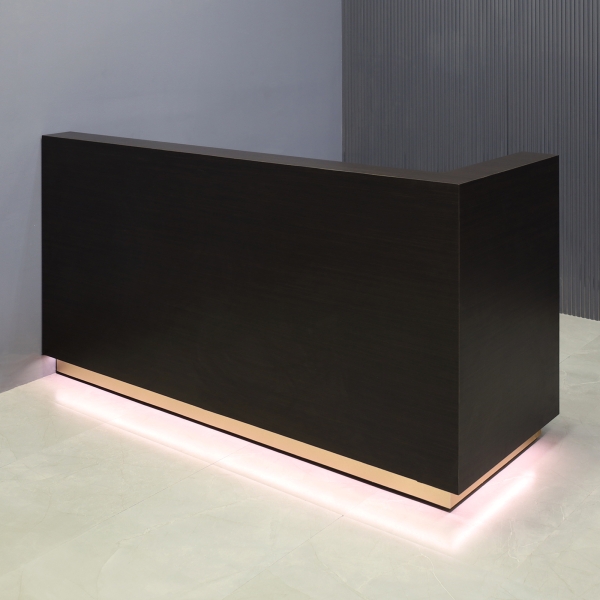 72-inch Dallas L-Shape Custom Reception Desk, right side when facing front in ebony recon matte laminate main desk and gold aluminum toe-kick, with warm white LED, shown here.