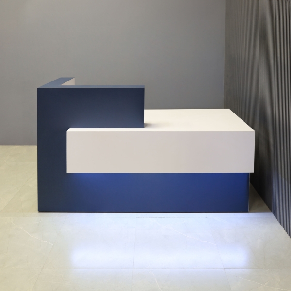 72-inch Atlanta Reception Desk, left side countertop when facing front, in midnight blue laminate countertop & base, white matte laminate workspace & front accent, and warm white LED.