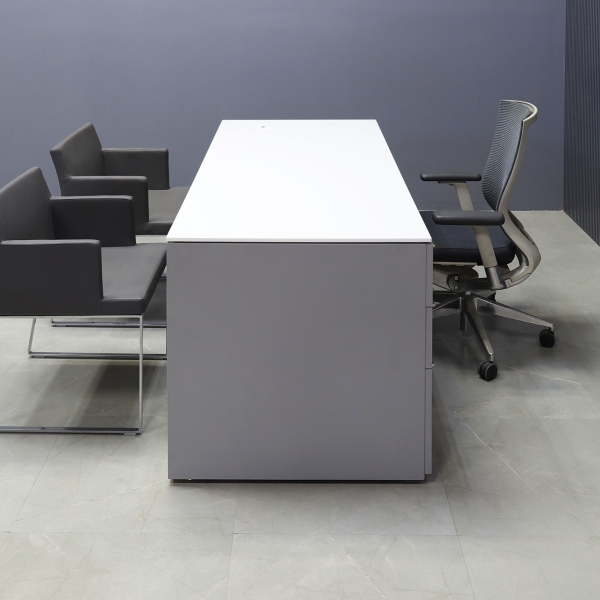 72-inch Denver Straight Executive Desk W/ left side cabinet when sitting, in 1/2-inch white solid engineered surface top and fog gray matte laminate finish base, cabinet & privacy panel.