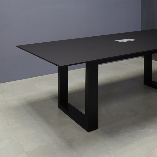 84-inch Aurora Rectangular Conference Table in 1/2-inch black traceless engineered surface top, black metal u legs powder coated, and silver MX3 power box.