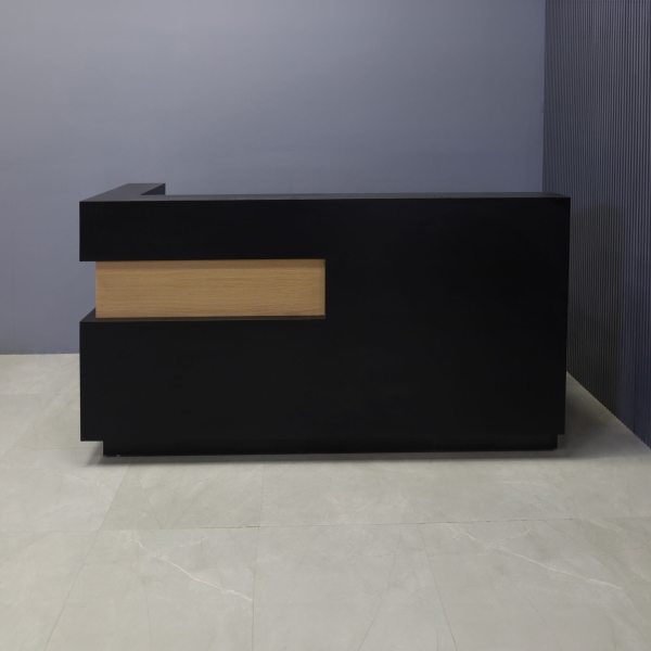 84-inch Manhattan L-Shape Custom Reception Desk in white oak veneer accent panel and black matte laminate main desk and toe-kick, shown here.